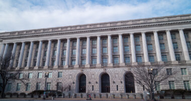 The IRS Building, headquarters of the Internal Revenue Service, in downtown Washington, D.C. seen from Constitution Avenue NW during a winter day. Low angle wide shot with no people visible.